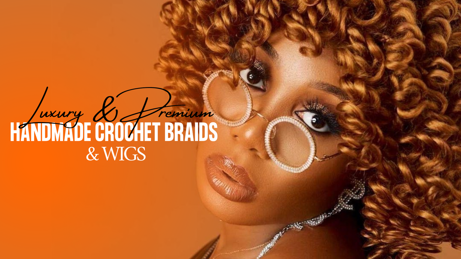 Close-up of a woman wearing glamorous round crystal-rimmed glasses and bold makeup, showcasing voluminous honey brown crochet curls styled in a boho-chic look.