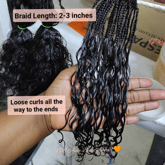 Black braided hair extensions held in a hand with text indicating braid length and curl pattern.