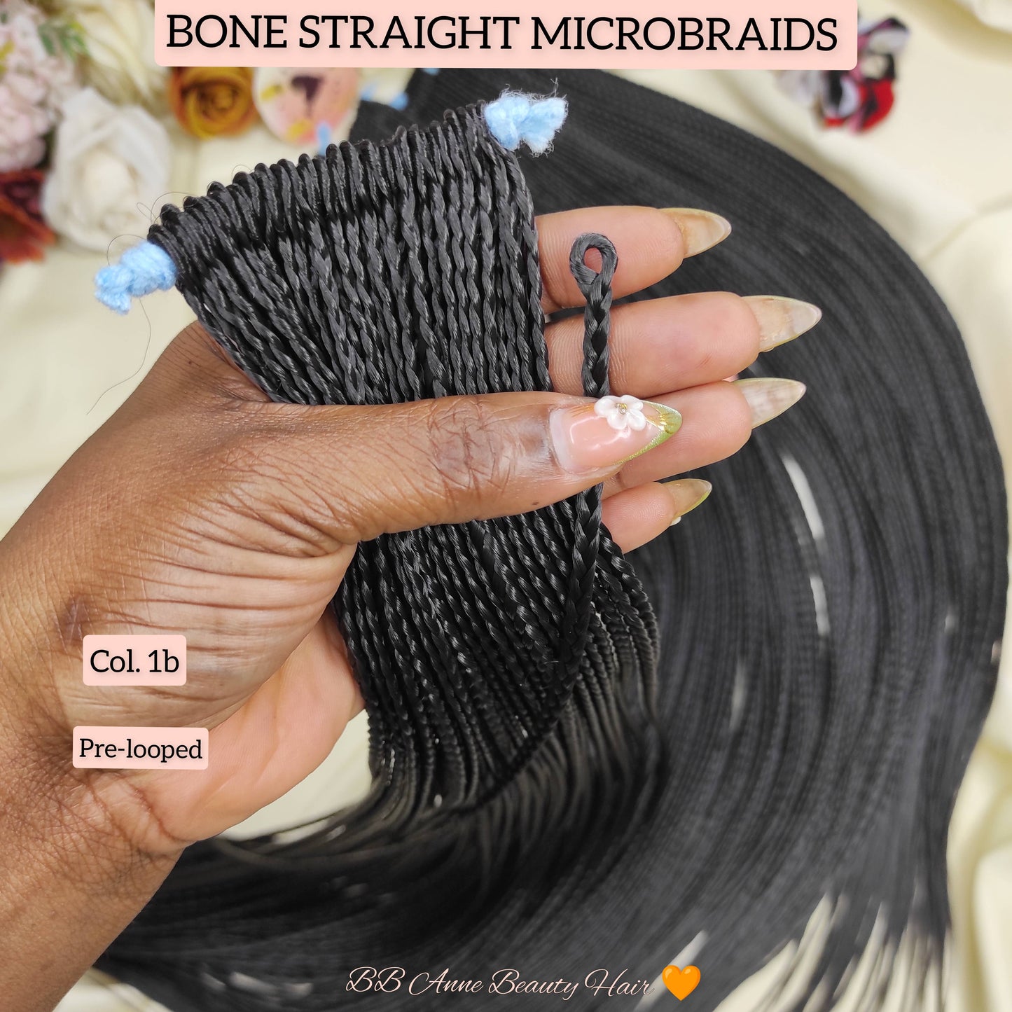 Hand holding bone straight microbraids with product details on a neutral background